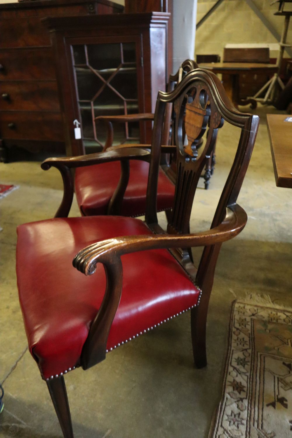 A set of eight George III inlaid mahogany dining chairs (2 with arms)